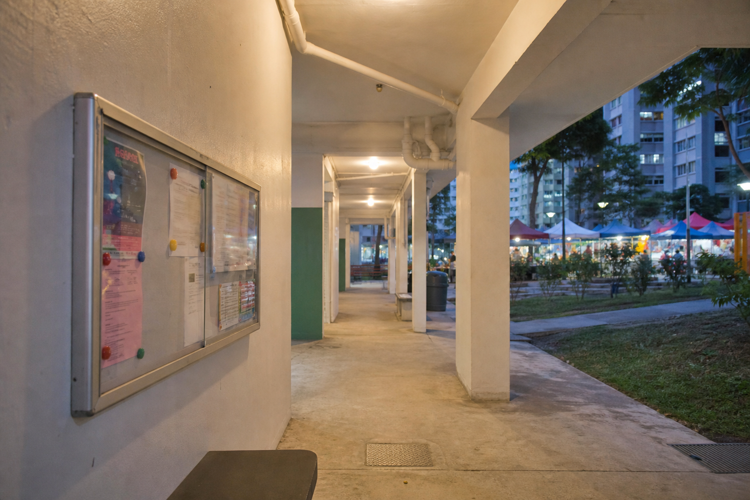 Covered walkway and void deck between HDB blocks in a Singapore neighbourhood
